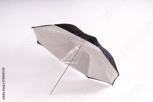 Photography studio light reflector - isolated on white background umbrella.