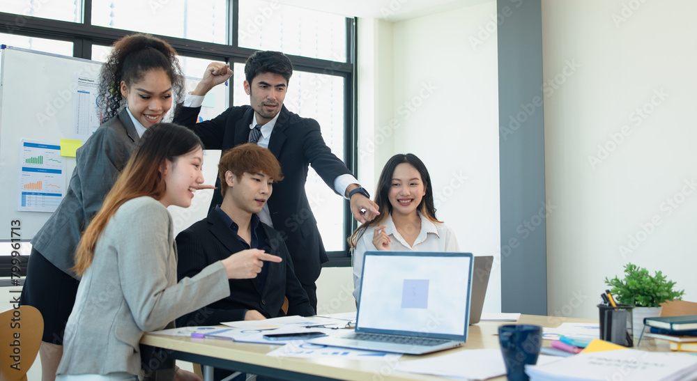 Asian group of people working with documents have financial or marketing charts on a board room table at a business presentation or seminar. Asian group of people working with documents have financial or marketing charts on a board room table at a business presentation or seminar.