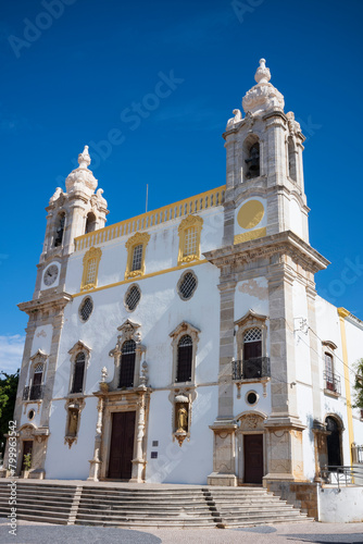 The Igreja do Carmo in Faro, with its Baroque façade and twin bell towers, located in Faro, Portugal.
