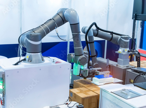 Robot arm with test tube for biological experiments in laboratory © xiaoliangge