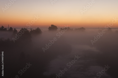 Sunrise over the misty river