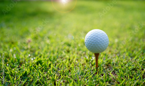 golf balls and golf equipment are ready to hit the sunlit green lawns in summer.