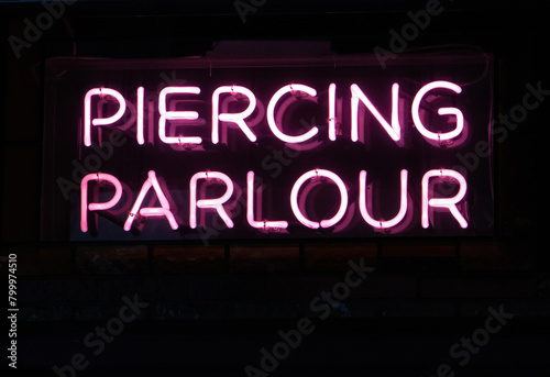 piercing parlour pink neon sign