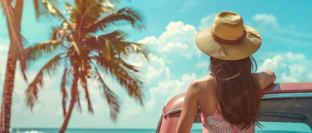 Summer vacation travel background - Young pretty woman in a straw hat leans on the car, beach, ocean, blue sky and palm trees