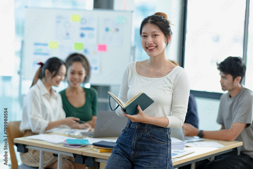 Asia young creative woman in smart casual wear looking at camera in office workplace. Asia young creative woman in smart casual wear looking at camera in office workplace.
