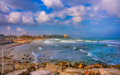 Mediterranean seaside of Tel Aviv.  Ancient city of Jaffa - the oldest part of Tel Aviv on the horizon.