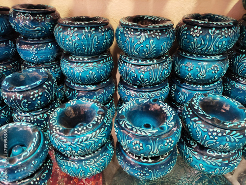 Blue ceramic plates with Arabic oriental ornaments on the shop window