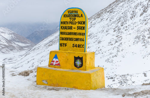 Sign marking the summit of Khardung La pass, at 17,582 feet one of the world's highest motorable roads photo