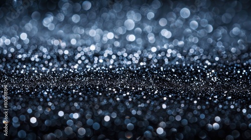 Soft blue lights creating a bokeh effect on a dark background suitable for festive or technology themes.