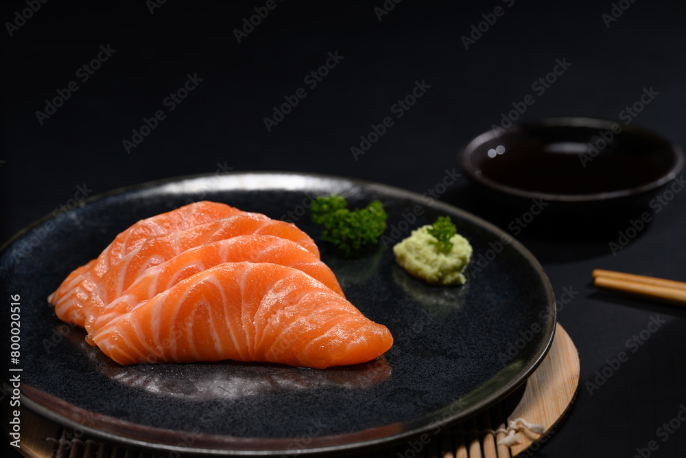 Sliced raw fatty salmon or salmon sashimi serve on with wasabi. Japanese food style concept Sliced raw fatty salmon or salmon sashimi serve on with wasabi. Japanese food style concept