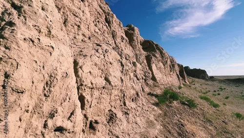 Turkestan walls of the ancient city of Sauran on a sunny day with a blue sky. Ancient buildings, fortress, ruins, ancient architecture in the settlement of Sauran. Archaeological excavations. 4К photo