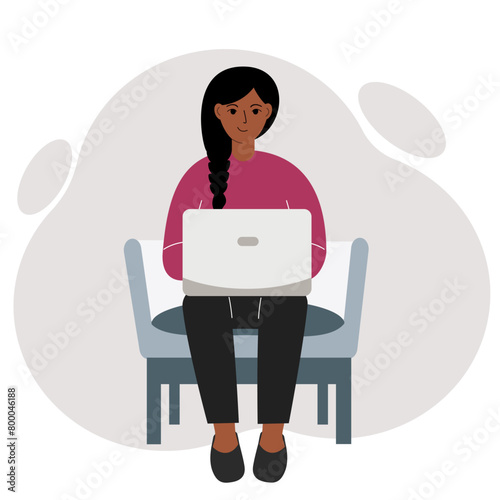 A woman sits in a chair with a laptop. Vector flat illustration