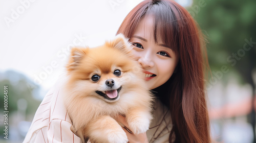 Pomeranian dog with a Asian woman © HappyPICS