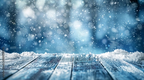 Close-up of fresh snowflakes falling on rustic wooden planks with a magical winter backdrop.