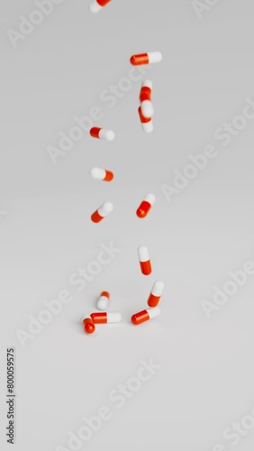White and red pills falling on light background in slow motion. Drugs, pills, tablets, medicine concept. 3d render animation. Vertical video (ID: 800059575)