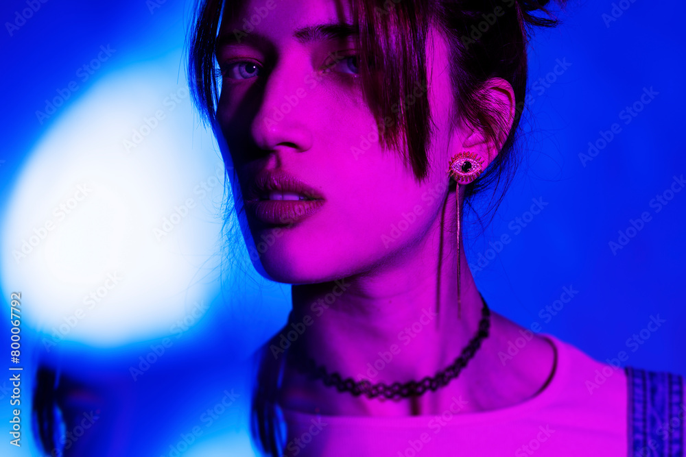 Beautiful young woman with illuminated face Beautiful young woman with illuminated face
