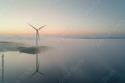 wind turbine on the top of mountain and sea, environment and renewable energy concept