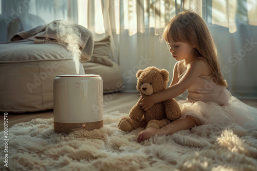 humidifier or diffuser. Modern white air humidifier or diffuser for home in children's room. girl playing in the children's room next to the humidifier