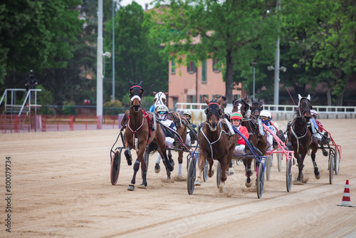 Group of jockeys race on the track of the Bologna Hippodrome