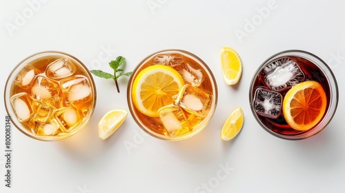 Refreshing summer beverages from above, iced tea and coffee assortment, ice and lemon slices visible, stark white background