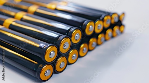 A row of black batteries with gold centers