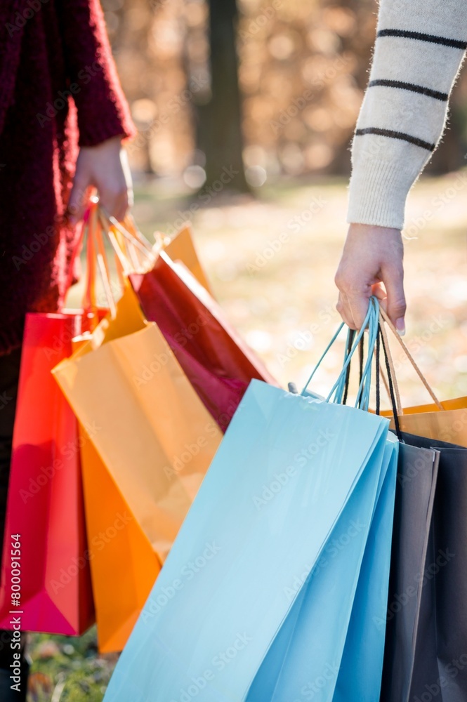 Retail Adventure: Woman Holding Shopper with Shopping Bags on Escalator - Captured in Crisp 4K image Retail Adventure: Woman Holding Shopper with Shopping Bags on Escalator - Captured in Crisp 4K image