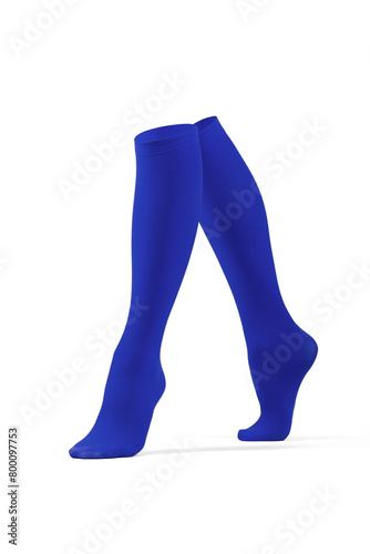 Close-up shot of a pair of blue shadow-proof knee socks with closely rims on the top. The pair of knee high socks are isolated on a white background. Side view. photo