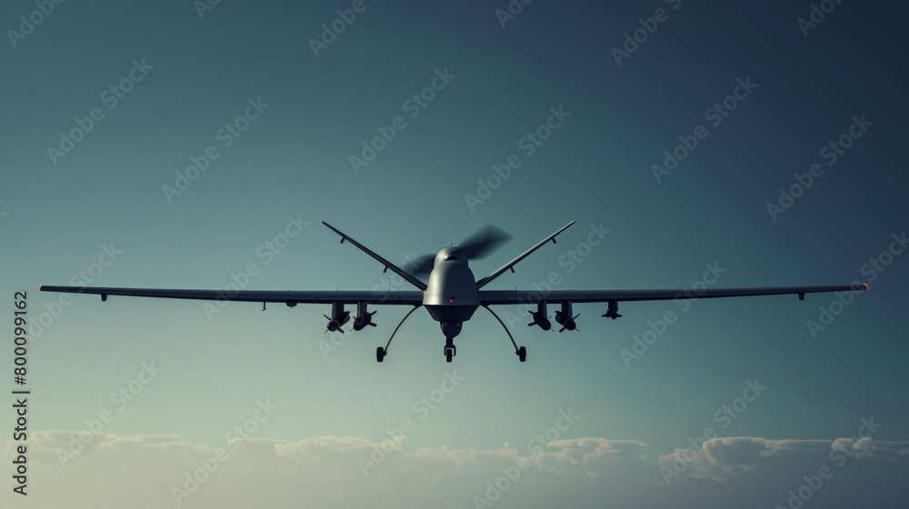 A stylish modern military combat UAV is flying across the sky. The sky is blue, clear, the sun is shining A stylish modern military combat UAV is flying across the sky. The sky is blue, clear, the sun is shining