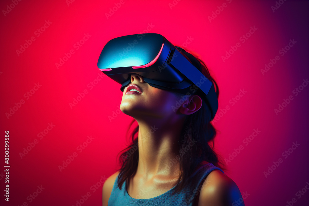 Young woman enjoying virtual reality experience in modern VR headset. Studying with new tech, simulation sciences. VR, Virtual Reality, VR Goggles. Latest technology, games, augmented reality, AI Young woman enjoying virtual reality experience in modern VR headset. Studying with new tech, simulation sciences. VR, Virtual Reality, VR Goggles. Latest technology, games, augmented reality, AI