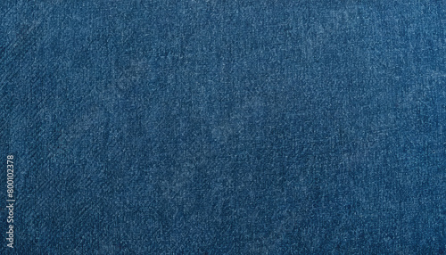Blue denim jeans fabric texture background closeup.