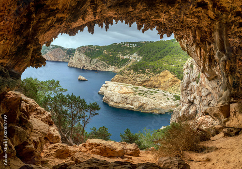 View of the northern coastline cliffs from Egragopilas cave near Portitxol, Sant Joan de Labritja, Ibiza, Balearic Islands, Spain