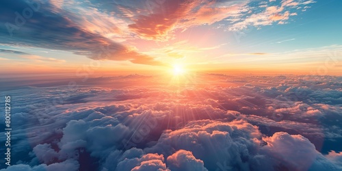Aerial view of a beautiful sunset as seen from the plane, view above the clouds photo