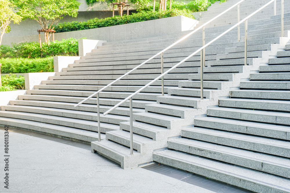 Fototapeta premium Empty Staircase to blue sky at rooftop and garden in morning,Long stair concrete in office building.