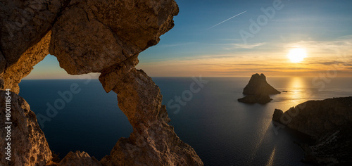 Panoramic view of Es Vedra islands at sunset from the Eye of Es Vedra viewpoint, Sant Josep de Sa Talaia, Ibiza, Balearic Islands, Spain photo