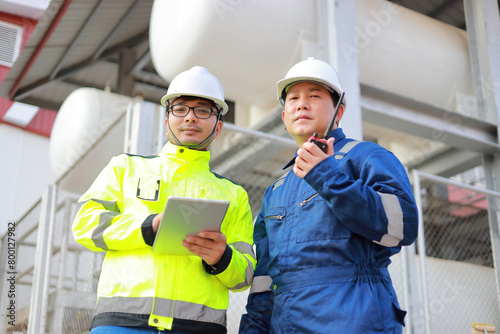 Portrait of professional man engineer working checking work place to keep liquid helium in industry. photo