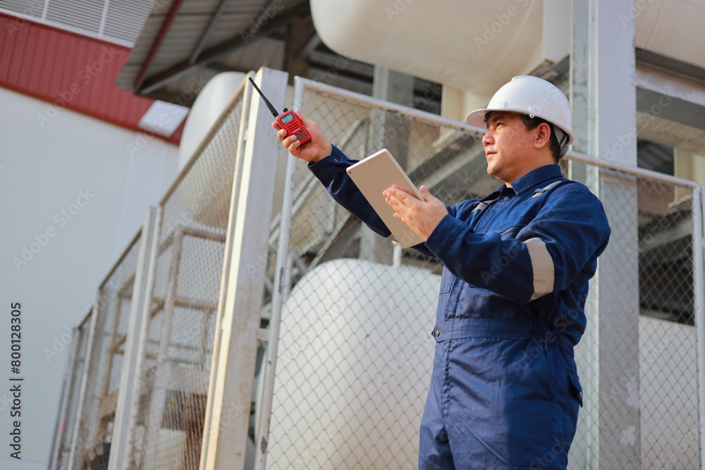 Portrait of professional man engineer working checking work place to keep liquid helium in industry. Portrait of professional man engineer working checking work place to keep liquid helium in industry.