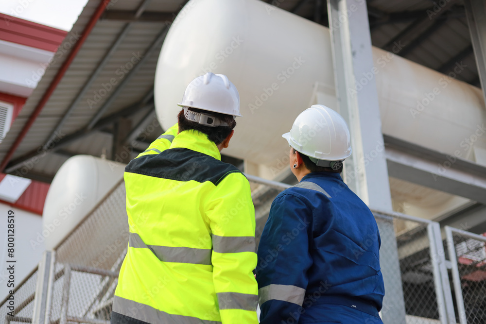 Portrait of professional man engineer working checking work place to keep liquid helium in industry. Portrait of professional man engineer working checking work place to keep liquid helium in industry.