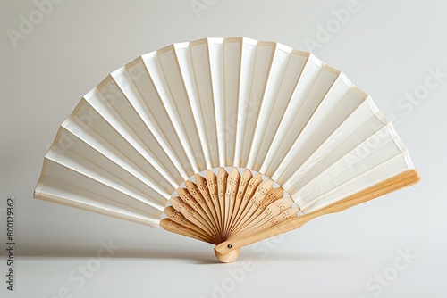 A close shot of a folding traditional white fan mockup for summer kept on a studio white background with space for text or product, Generative AI.