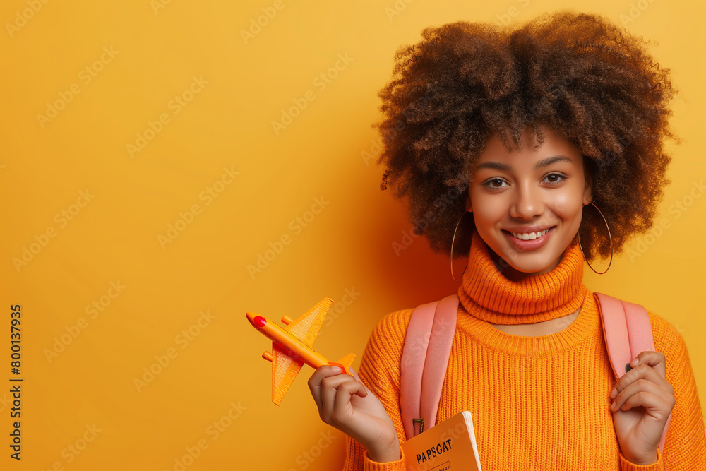 Portrait of a teenager who wants to explore the world. Holding an airplane ticket with a world map and a model airplane, studying abroad, traveling Portrait of a teenager who wants to explore the world. Holding an airplane ticket with a world map and a model airplane, studying abroad, traveling