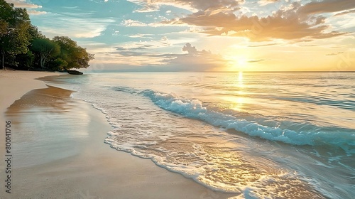 Golden sunrise casting a warm glow over a tranquil beach with soft waves. 