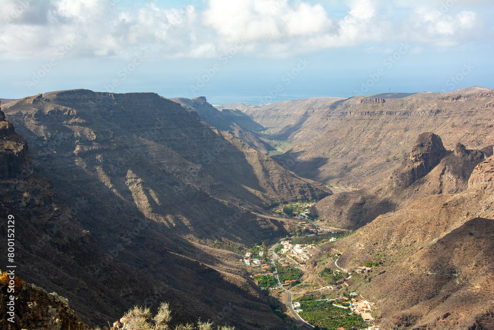 Mountains with a small village in the valley Mountains with a small village in the valley