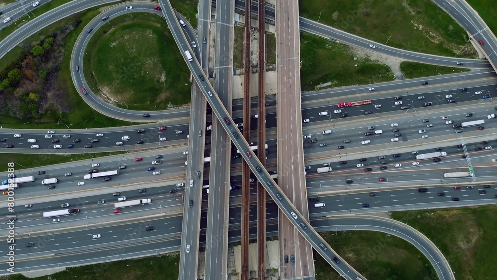 Metropolitan arteries pulsing with cars, aerial showcase of urban pace
