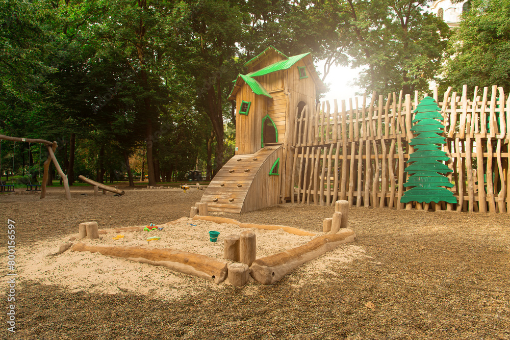 playground for kids decorative wooden castle with sand around and sun light effect in the park playground for kids decorative wooden castle with sand around and sun light effect in the park