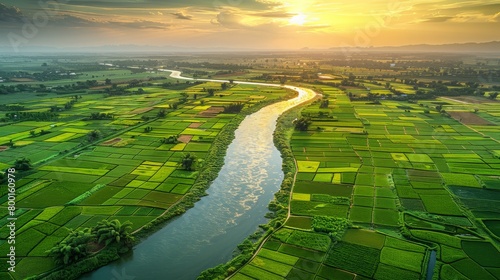 Golden hour over cultivated fields with curving river, illustrating farming harmony and the golden light of sunset concept photo