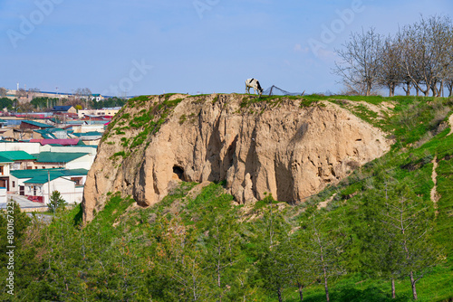 Afrosiyab Hill as seen from the Khoja Doniyor (Saint Daniel) Mausoleum in Samarkand, Uzbekistan - Grassy hill that was the site of a Sogdian city photo