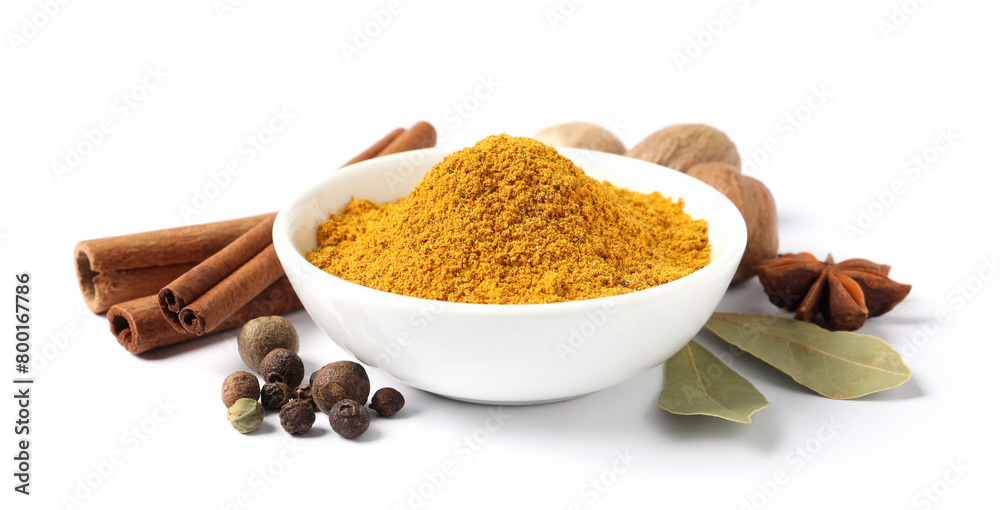 Dry curry powder in bowl surrounded by other spices isolated on white Dry curry powder in bowl surrounded by other spices isolated on white