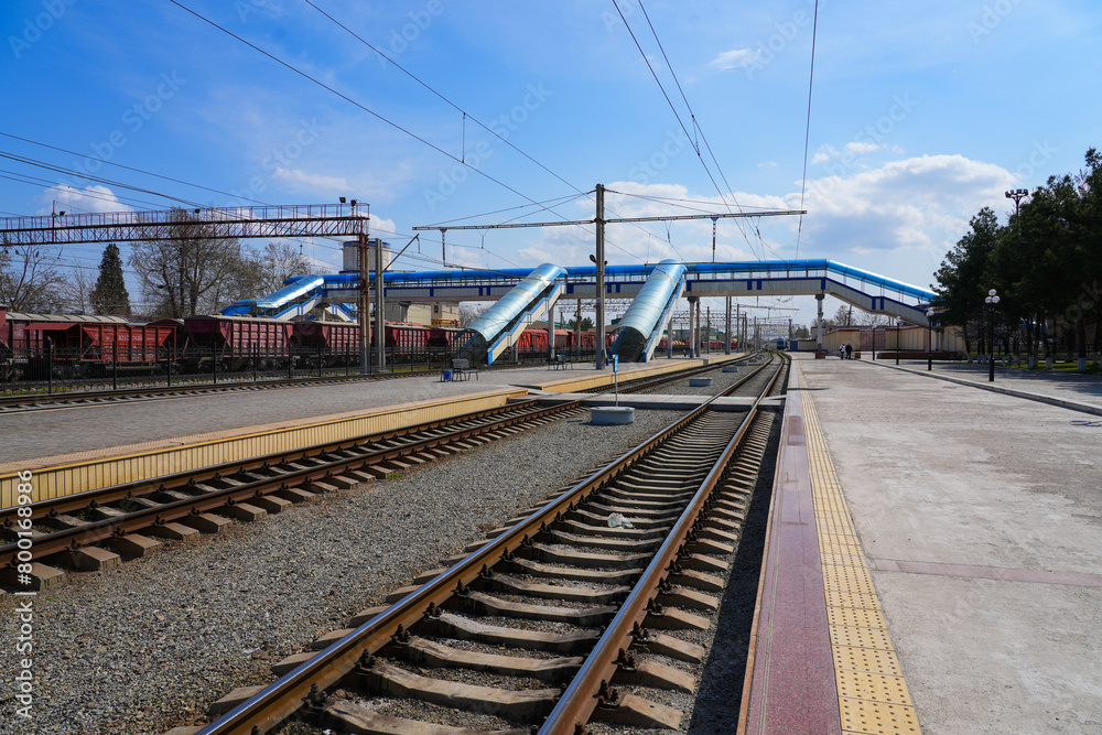 Pedestrian footbridge passing over the railway tracks at Samarkand Train Station in Uzbekistan, Central Asia Pedestrian footbridge passing over the railway tracks at Samarkand Train Station in Uzbekistan, Central Asia