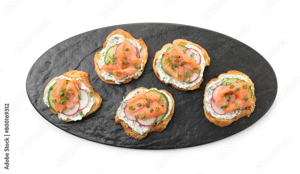 Tasty canapes with salmon, cucumber, radish and cream cheese isolated on white, top view