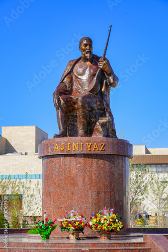 Statue of the Uzbek poet Ajiniyaz Kosibay Uli on the public square in front of the Nukus Museum of Art or Igor Savitsky Museum in the capital of Karakalpakstan, western Uzbekistan, Central Asia