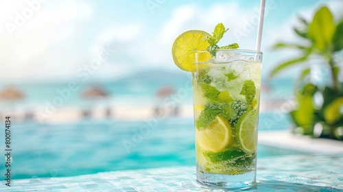 Refreshing mojito cocktail with lime and mint on the beach